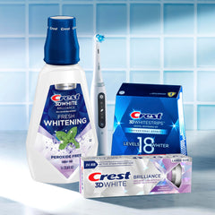 Crest 3D White Brilliance mouthwash pack shot showing six 1L bottles