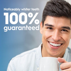 Crest 3D Whitestrips Sensitive + LED Light strip on lower teeth in use