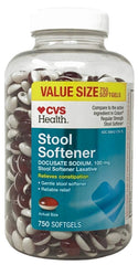 CVS Health Stool Softener softgels bottle pour demonstrates easy dosing and portability.