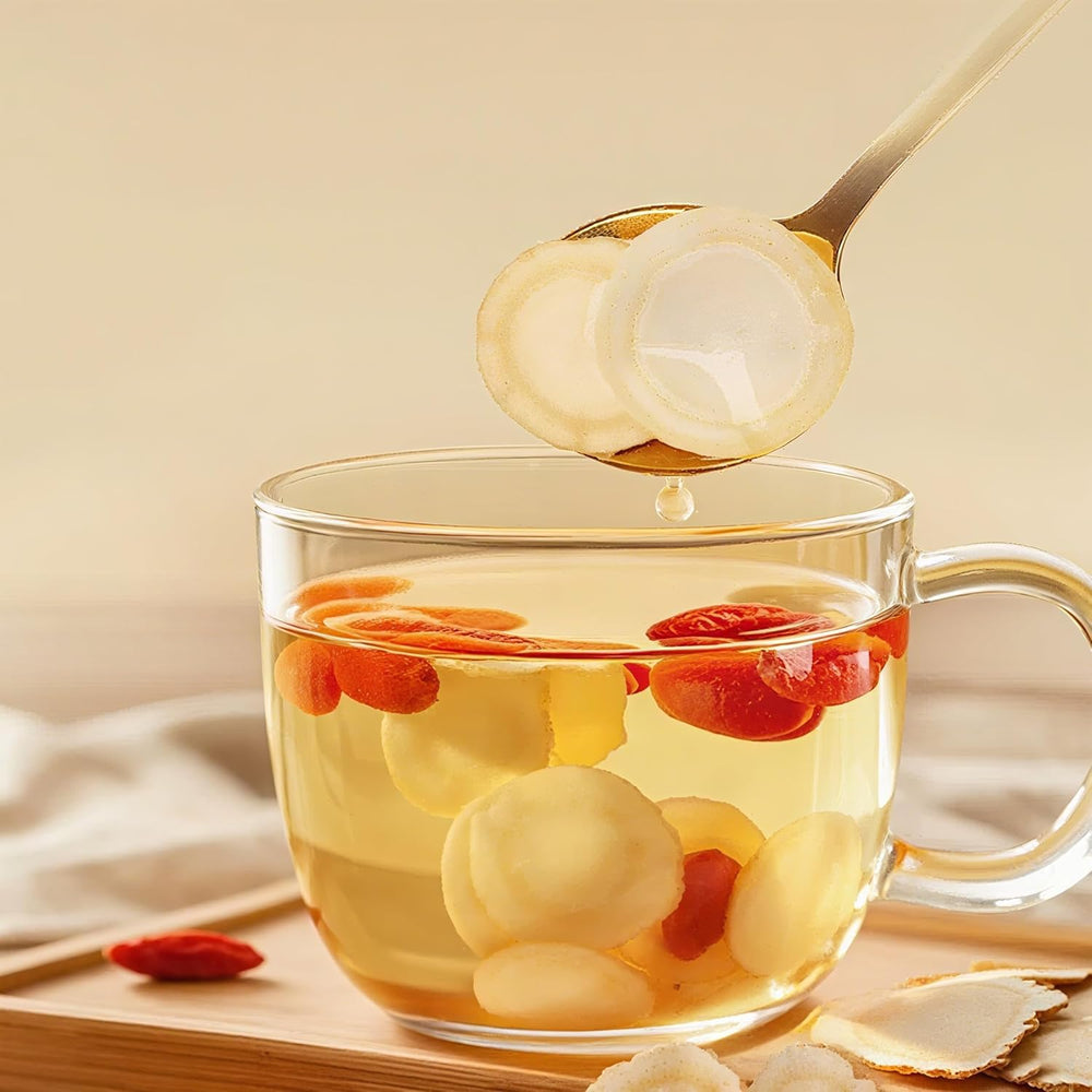 Ginseng slices steeped in tea cup for a gentle energy lift