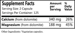 Closeup of Daily Manufacturing Dolomite capsules showing vegan and gluten-free formulation