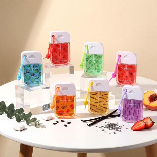 Travel-size 1.35 oz Dansib sprays attach to bags by keychain