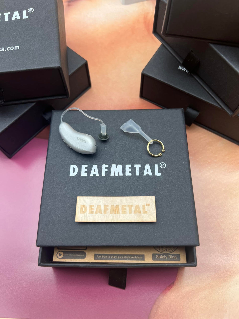 Deafmetal fashion-forward accessory improves confidence while securing devices.