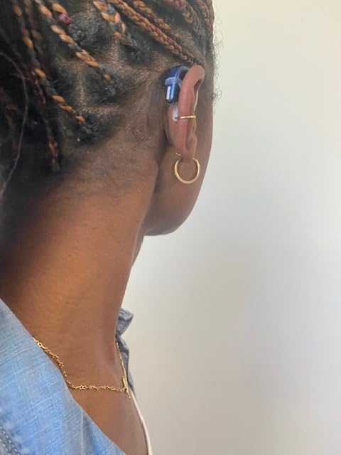 Deafmetal gold galvanized cuff on ear emphasizes fashion-forward retention.