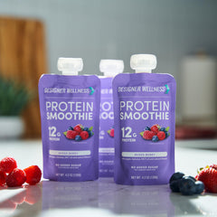 Designer Wellness mixed-berry serving cup illustrating everyday protein boost.