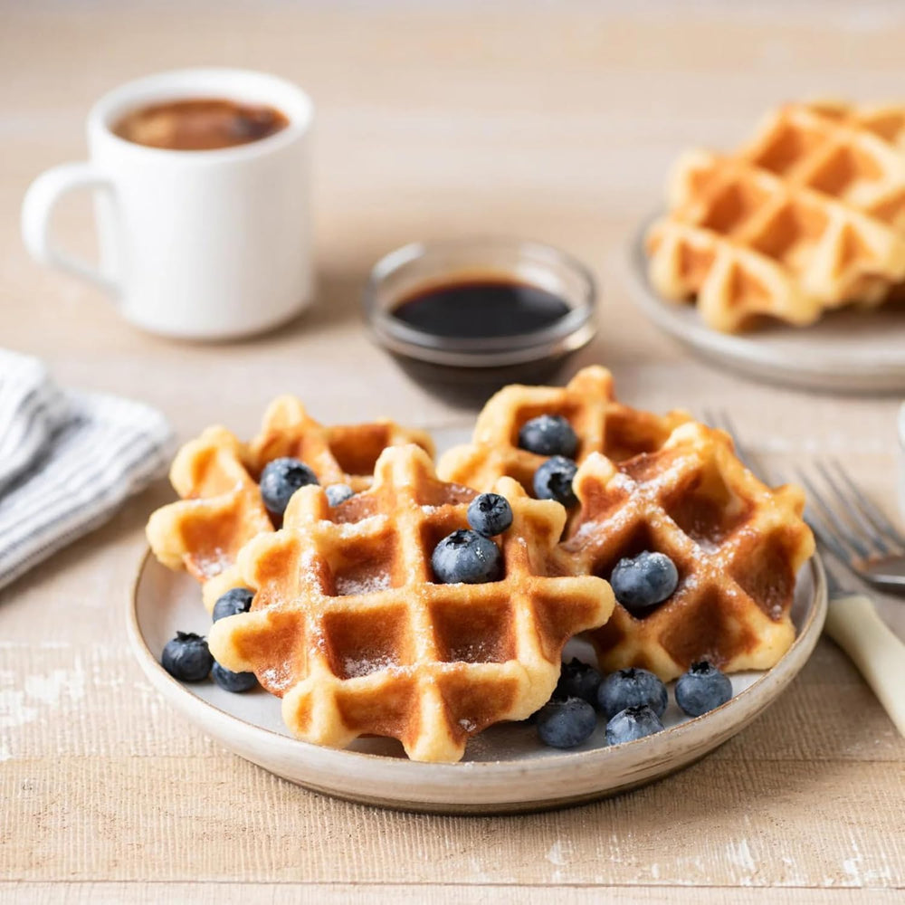 Devotion Nutrition Wild Blueberry coffee creamer blending into a creamy latte.