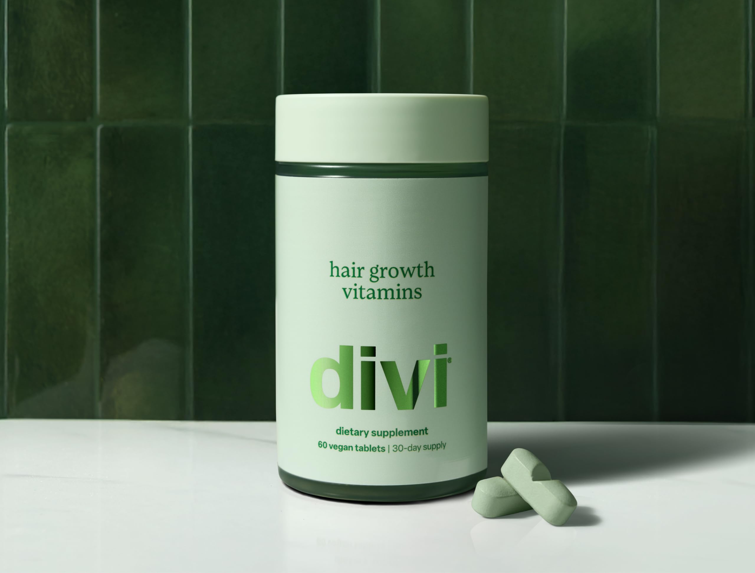 Divi Hair Growth Vitamins on a sink setup illustrates practical daily self-care