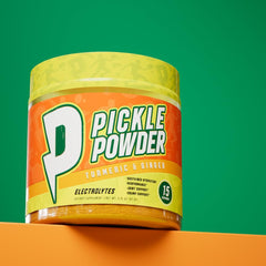 Divine Health Pickle Powder Lemon Zest in a glass of water showcasing easy mixing