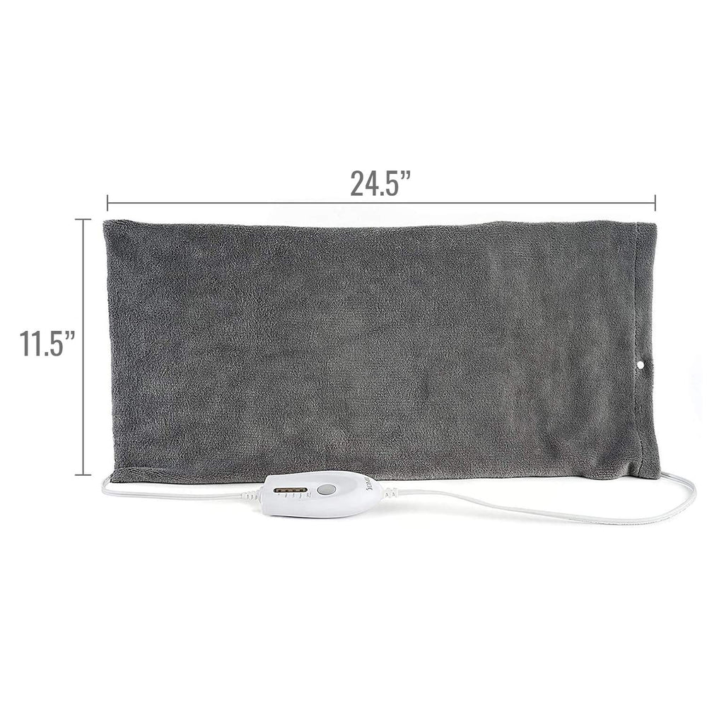DMI heating pad in use on back for targeted relief.