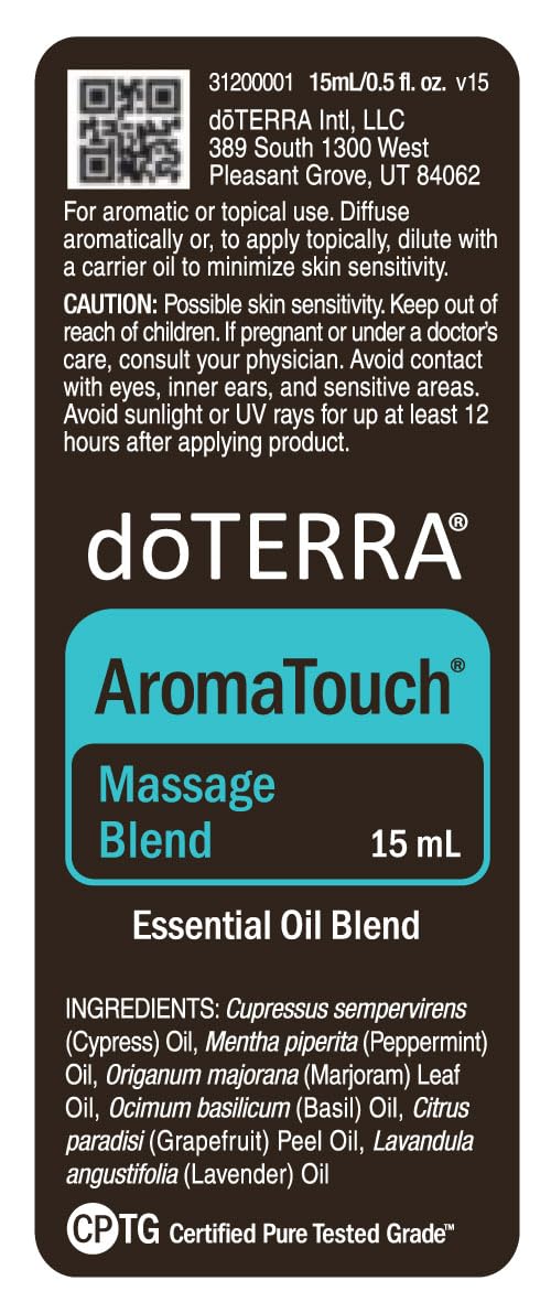 doTERRA AromaTouch lifestyle shot showing home massage setup.