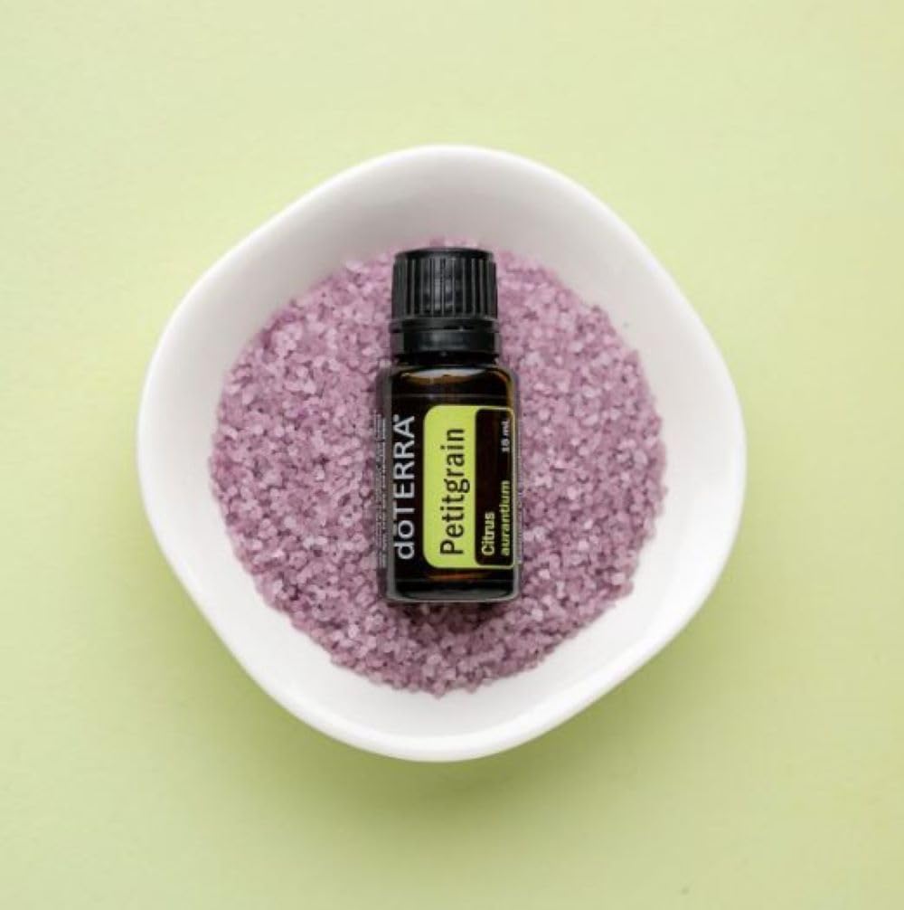 Close-up of Petitgrain oil diffused drops for room aroma.