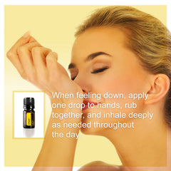 doTERRA Cheer bottle held beside a sunny setting for mood lift.