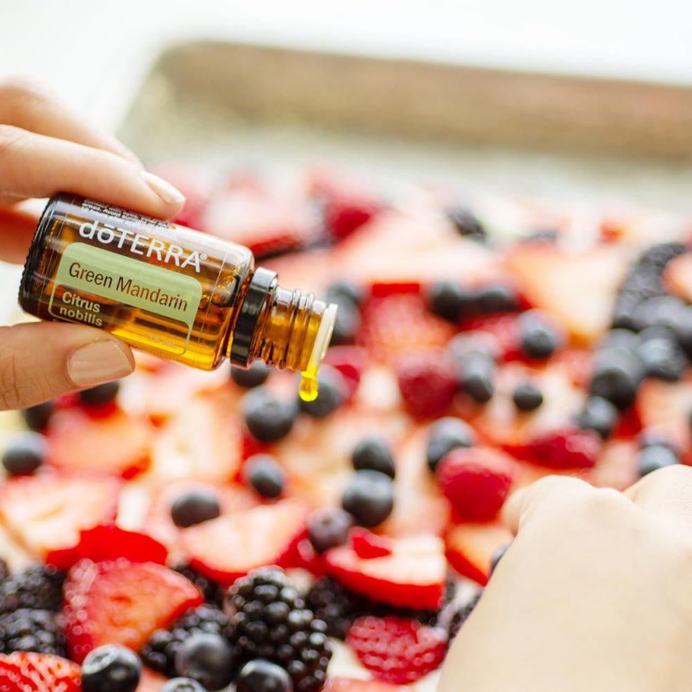 doTERRA Green Mandarin imagery with citrus fruit to suggest freshness