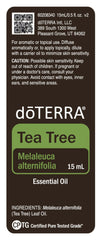 doTERRA Melaleuca bottle label close-up shows quality and purity guarantees.