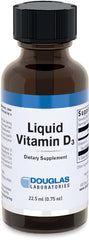 Douglas Laboratories Liquid Vitamin D3 bottle on table supports easy daily supplementation.