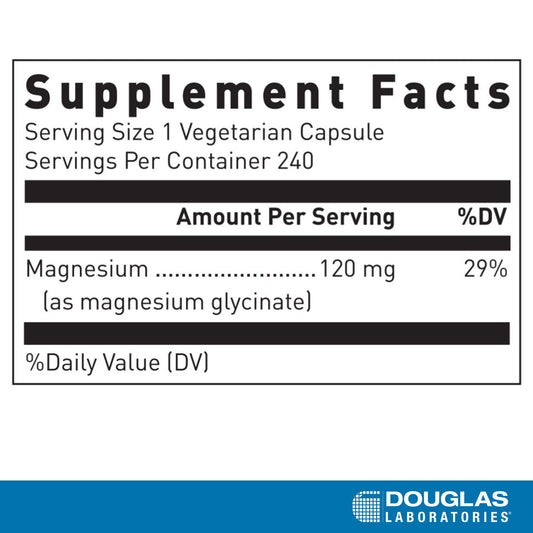 Close-up of Douglas Laboratories Magnesium Glycinate tablet showing chelated magnesium
