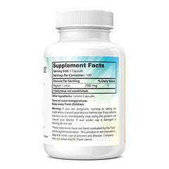 Open bottle with capsules scattered to illustrate product texture