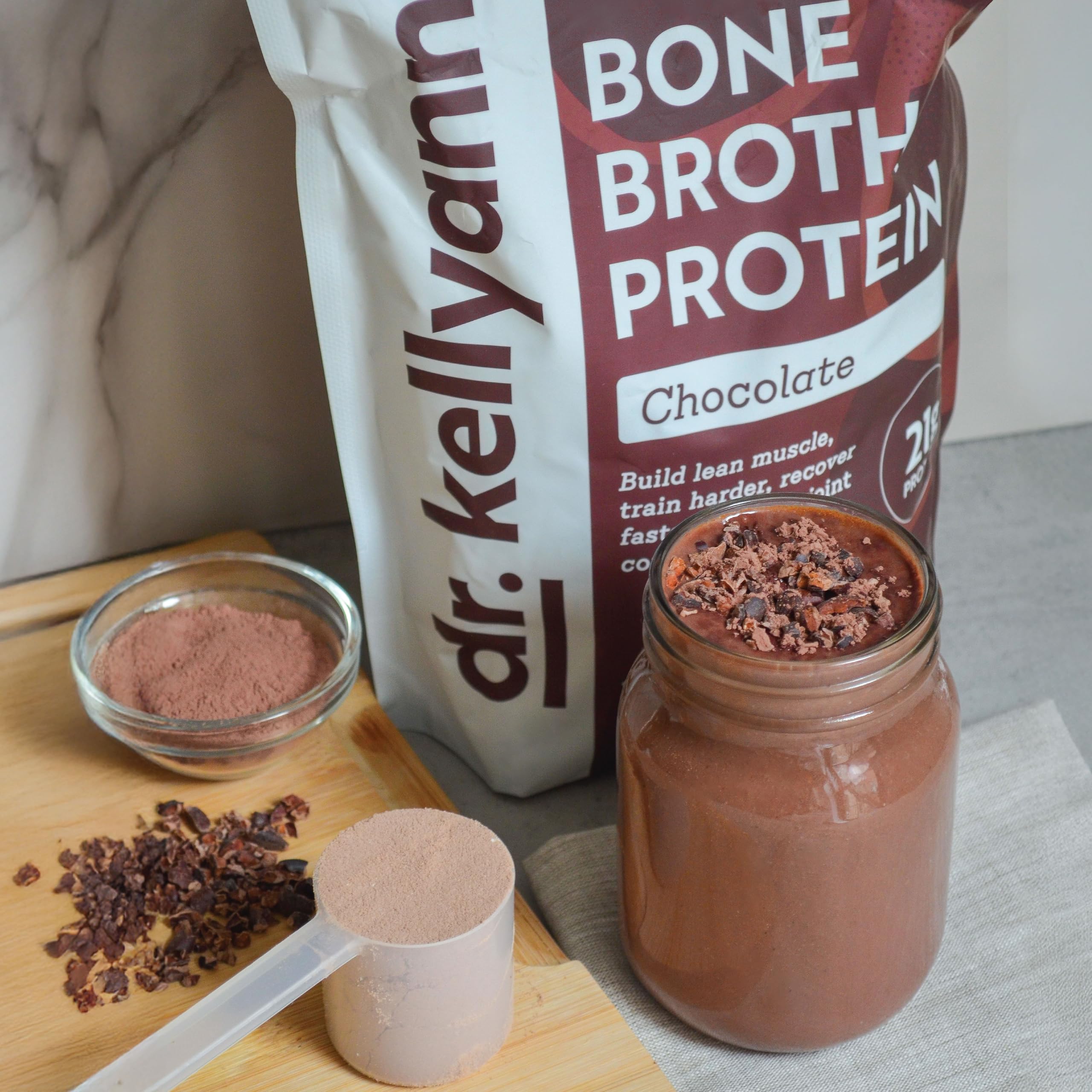 Dr. Kellyann Keto Bone Broth Protein Powder Chocolate label highlighting dairy-free gluten-free benefits.