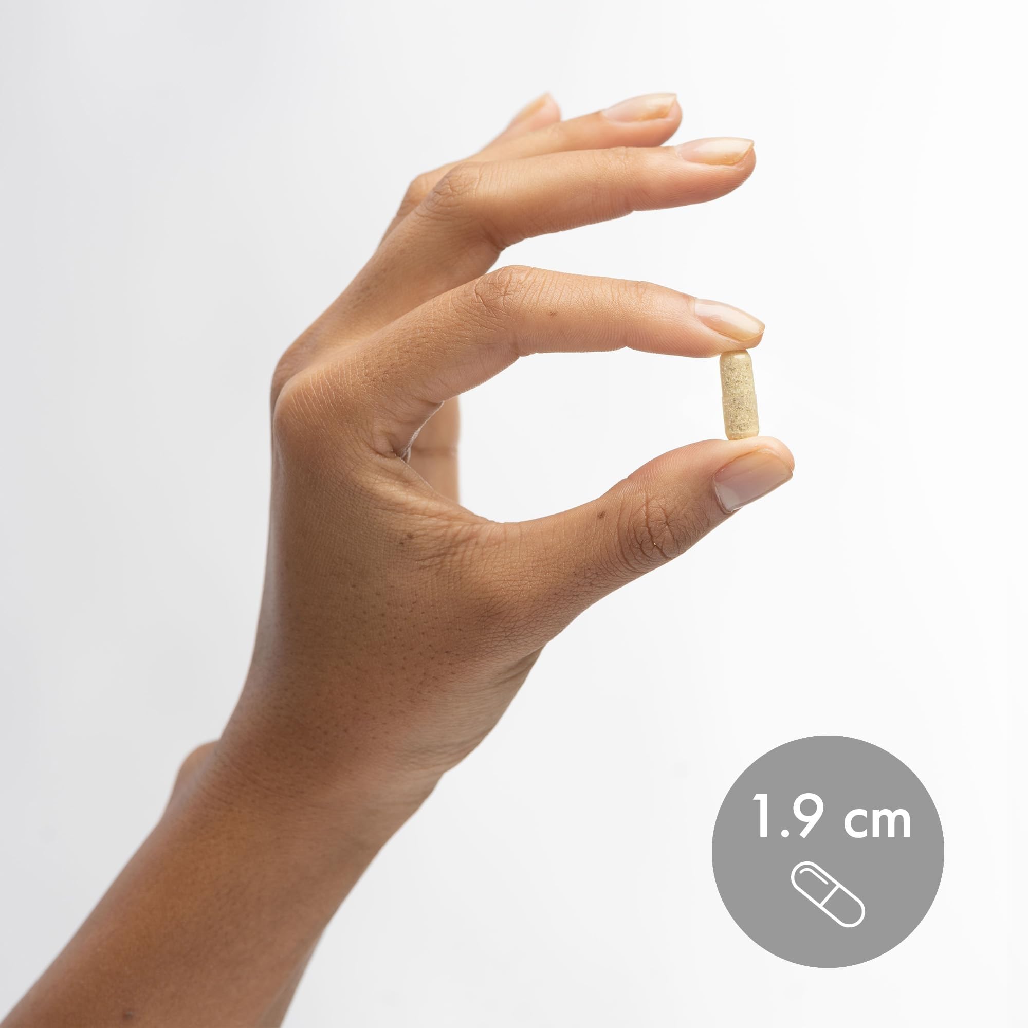 Capsules in hand illustrating easy daily use of Dr. Mercola L-Theanine Plus GABA.