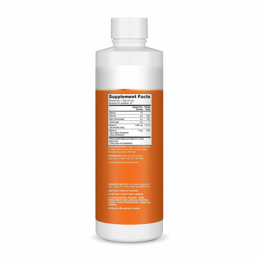 Pouring Dr. Mercola Liposomal Vitamin C to show smooth texture for easy mixing.