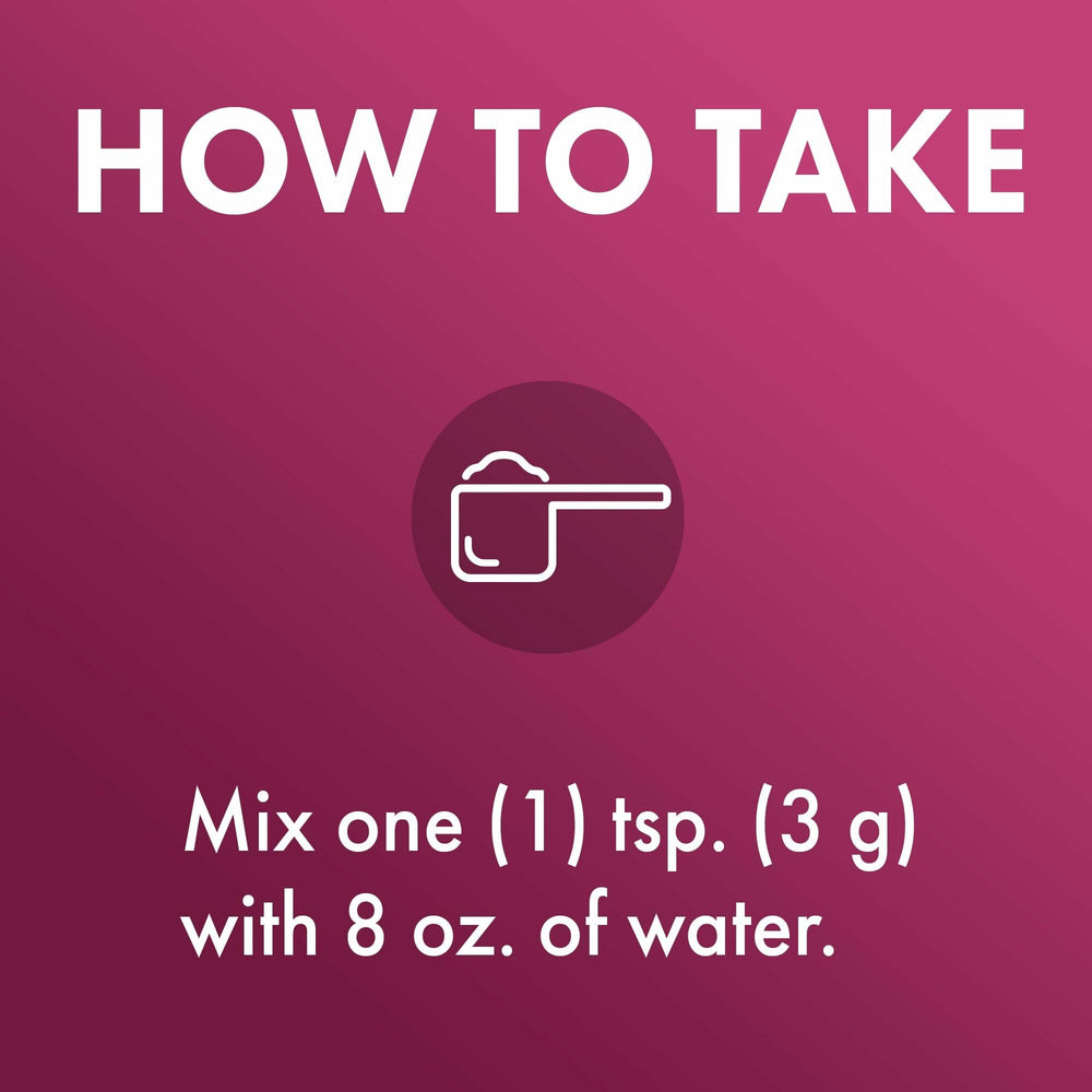 Scoop of Dr. Mercola Organic Fermented Fruits beside a glass to show easy mixing.