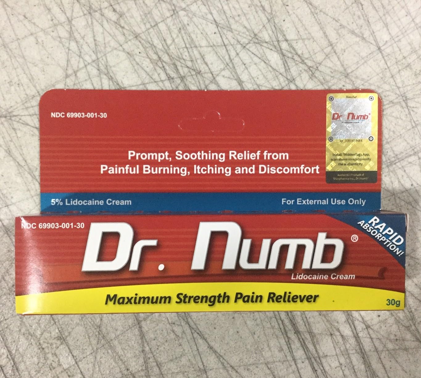 Dr. Numb tube cap close-up highlighting secure cap and fast-acting formula.