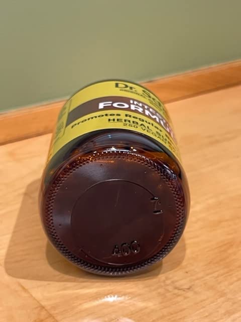 Dr. Schulze's Intestinal Formula #1 bottle on countertop suggests easy daily use.