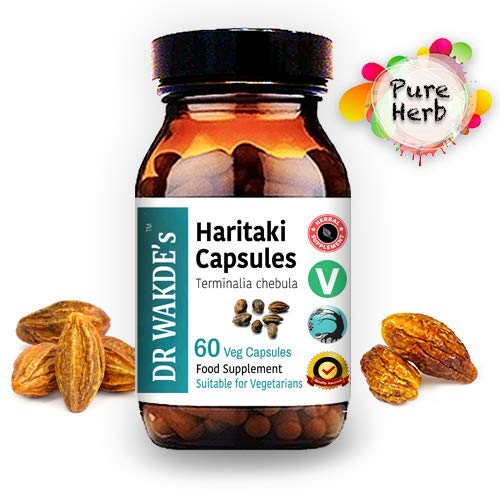 Close-up of DR WAKDE'S Haritaki capsules showing pure herbal form for daily use.