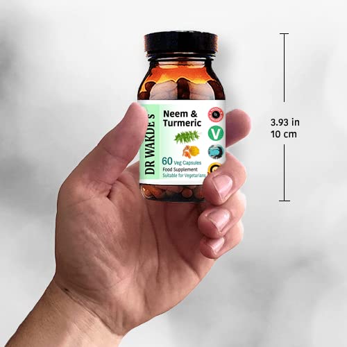 DR WAKDE'S Neem & Turmeric capsules with a cup of tea for routine use.