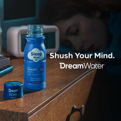 Dream Water Snoozeberry in a night-time scene on a bedside surface.