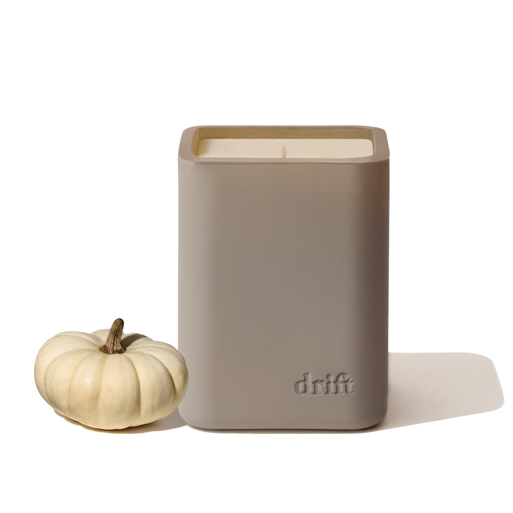 Drift White Pumpkin candle label on a clear jar enhances warm ambience.
