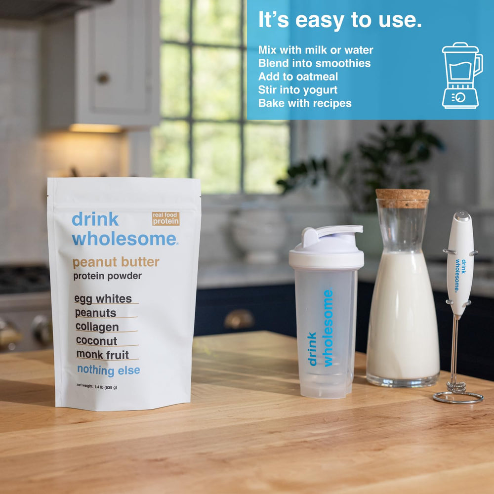 Drink Wholesome minimal-processed ingredients jar with wooden scoop.