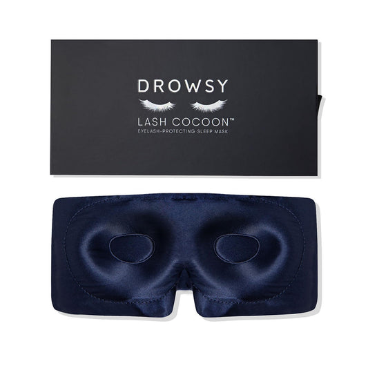 Drowsy eyelash-protecting silk sleep mask in midnight blue shields lashes gently.