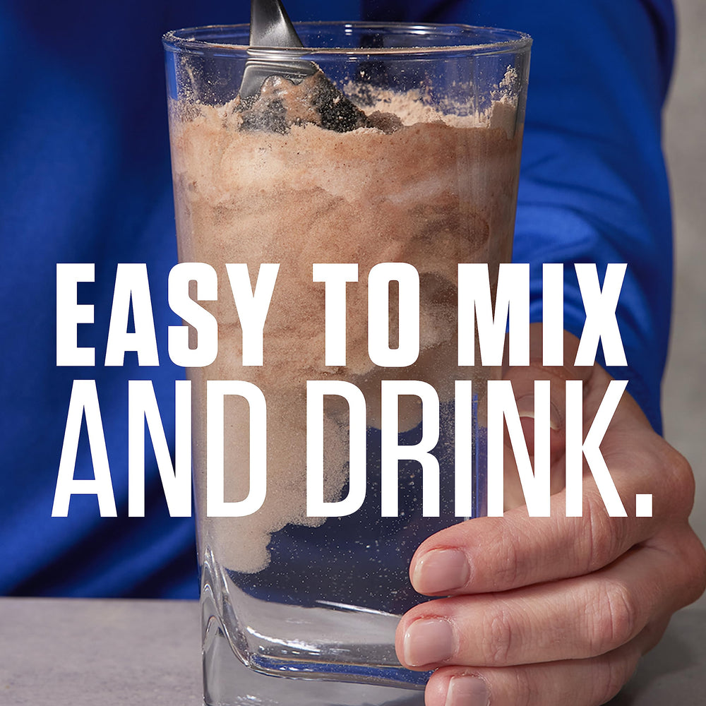 Dymatize Super Mass Gainer shake in glass showing creamy texture
