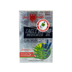 Applying Eagle Brand medicated oil to the skin on the arm