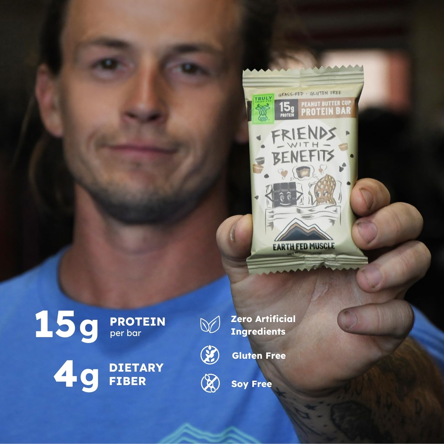 Earth Fed Muscle bar pack with label highlighting gluten-free and non-GMO claims.