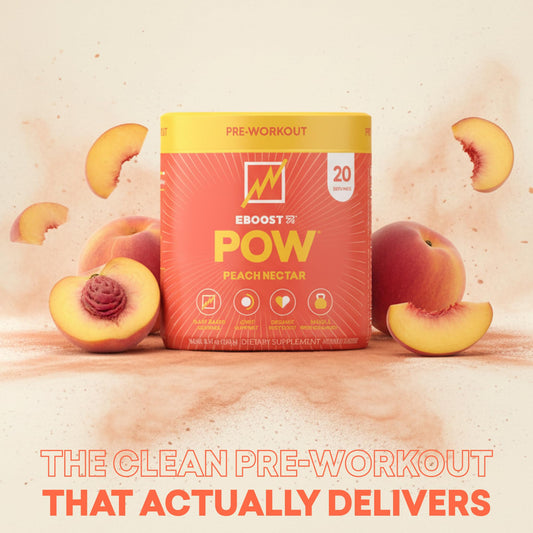 Scoop of EBOOST POW dissolving in water for a quick focus and energy boost.
