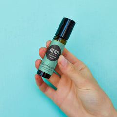 Close-up of Age Defy roll-on tip for precise application and scent