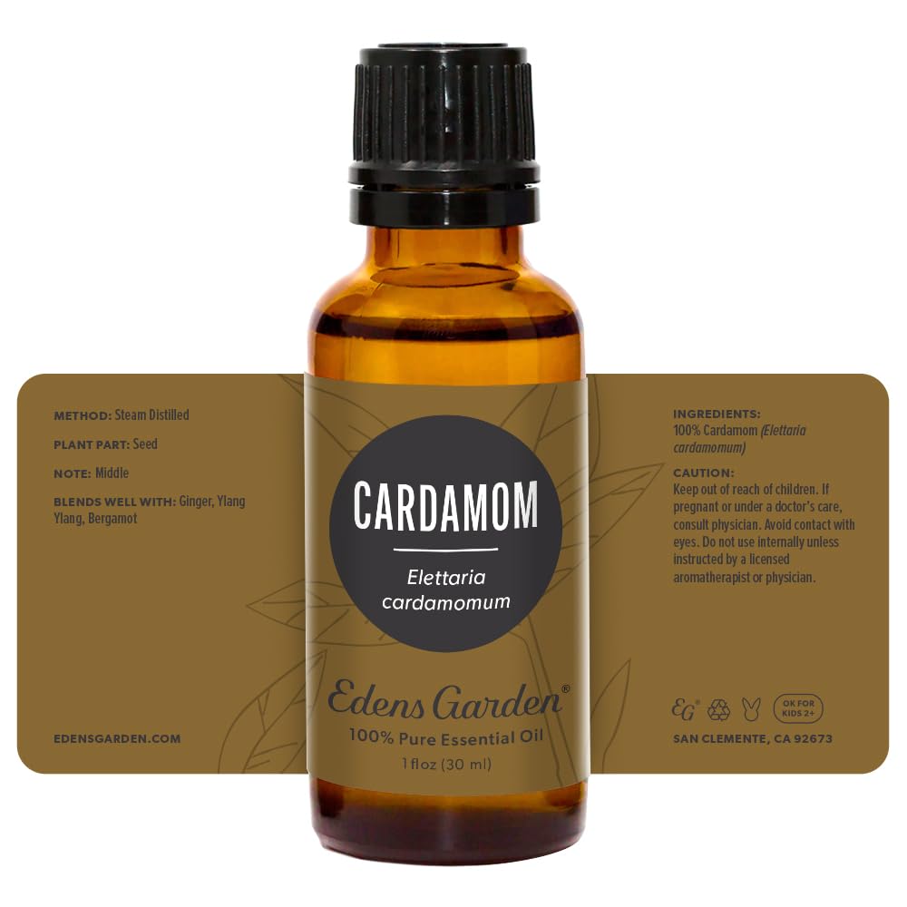 Edens Garden Cardamom essential oil bottle beside humidifier setup.