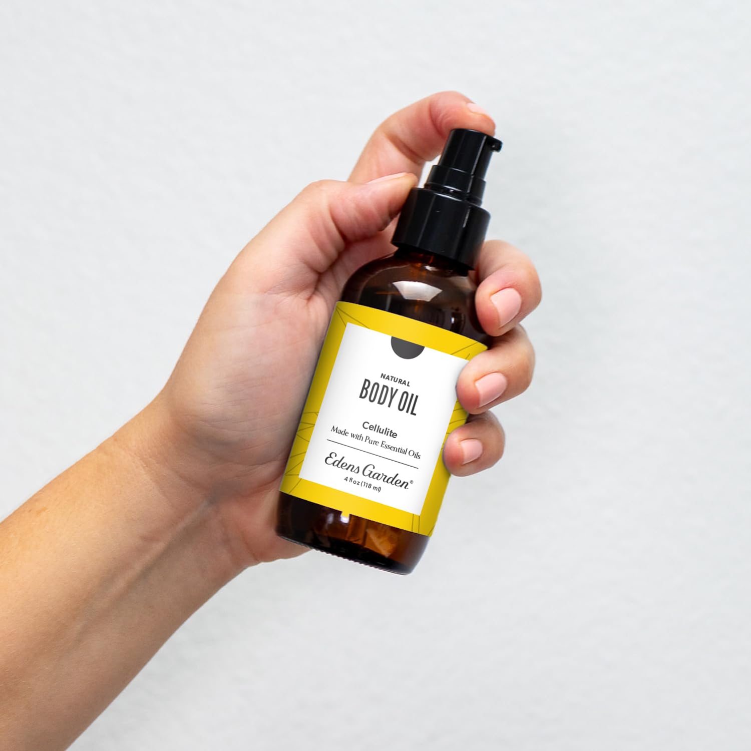 Edens Garden cellulite oil pour demonstrates easy application and calming scent