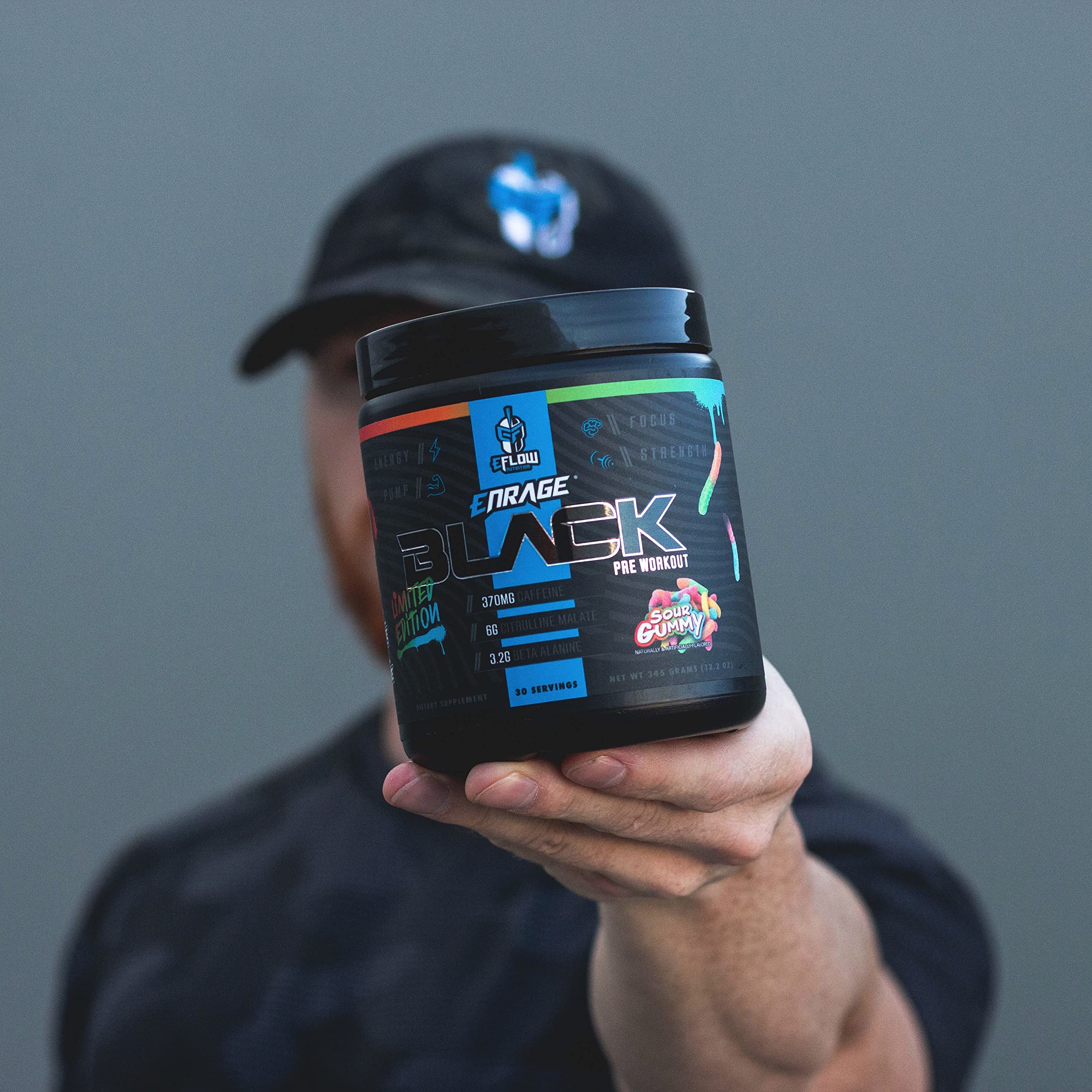 Powder being dispensed from tub for quick pre-workout mix