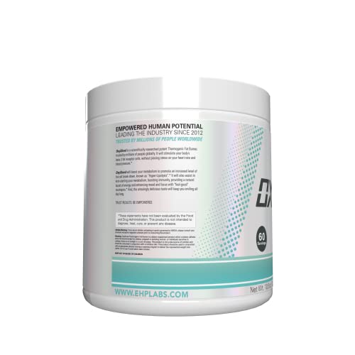 Scoop of OxyShred beside the tub for precise dosing.