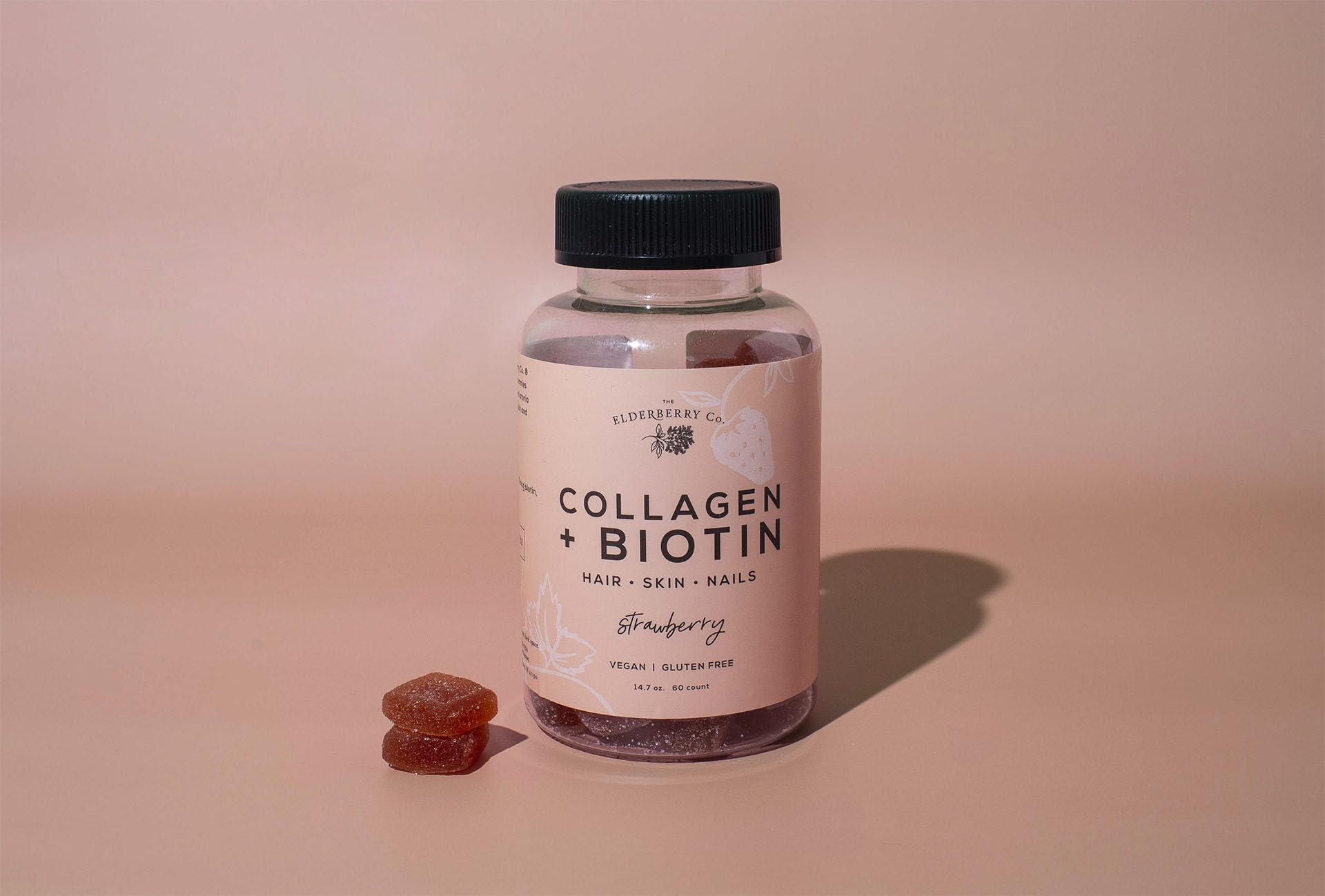 The Elderberry Co. collagen biotin Gummies bottle close-up for hair and nails health.