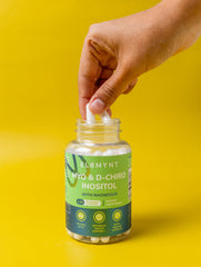 Vegan non-GMO seal on ELEMYNT bottle for plant-based wellness