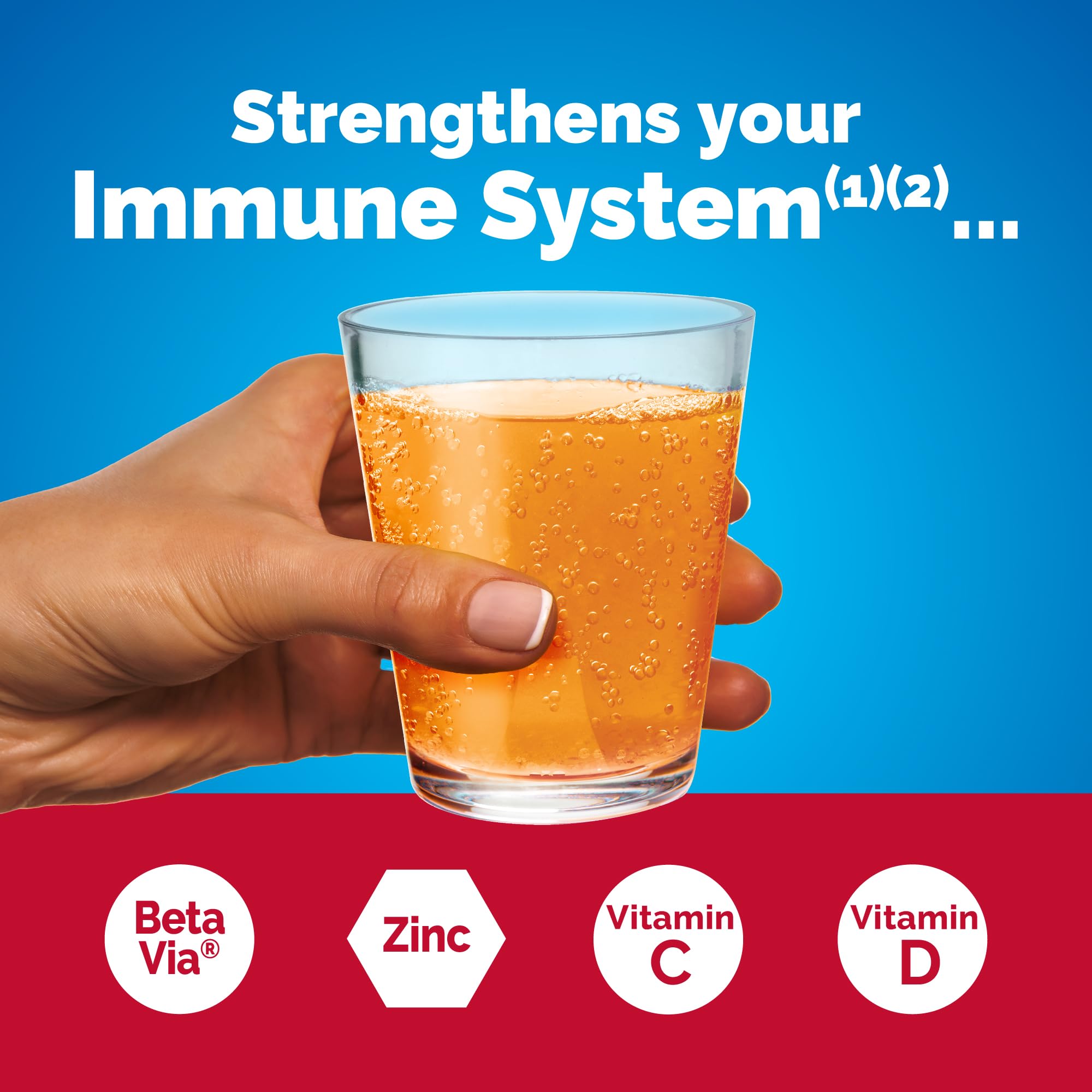Scoop of Emergen-C Immune+ powder dissolving in water