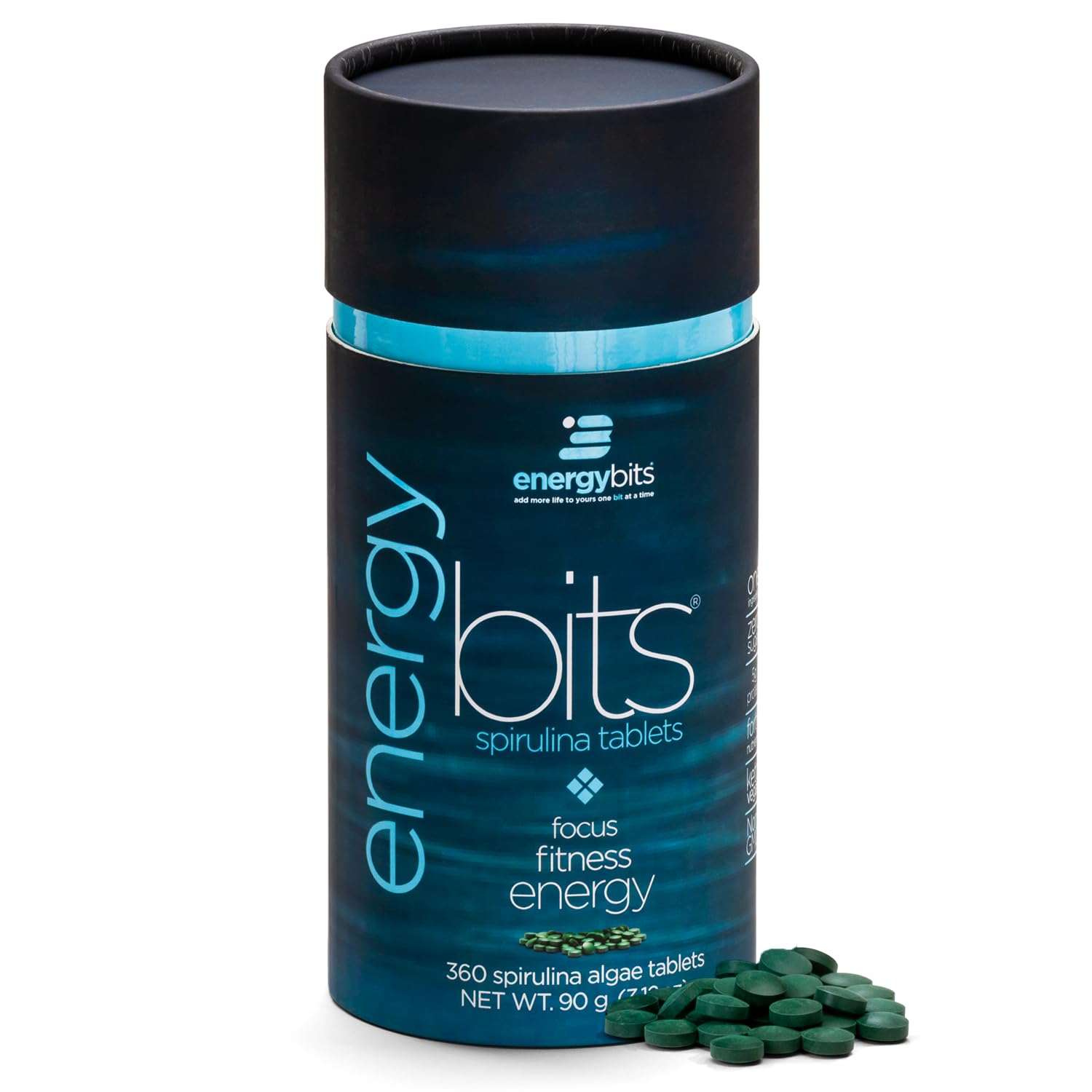 ENERGYBITS spirulina tablet close-up showing a compact energy source for quick focus