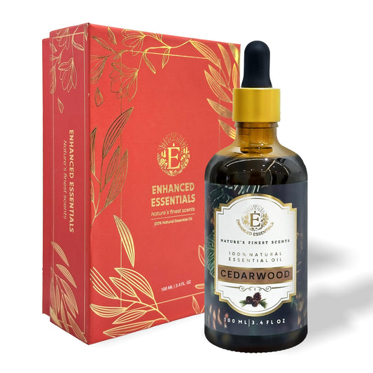 Enhanced Essentials Cedarwood bottle pour demonstrates grounding aroma for diffusers.