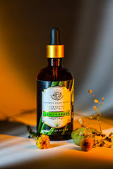 Enhanced Essentials Lemongrass essential oil dropper dispensing precise drops for skincare.