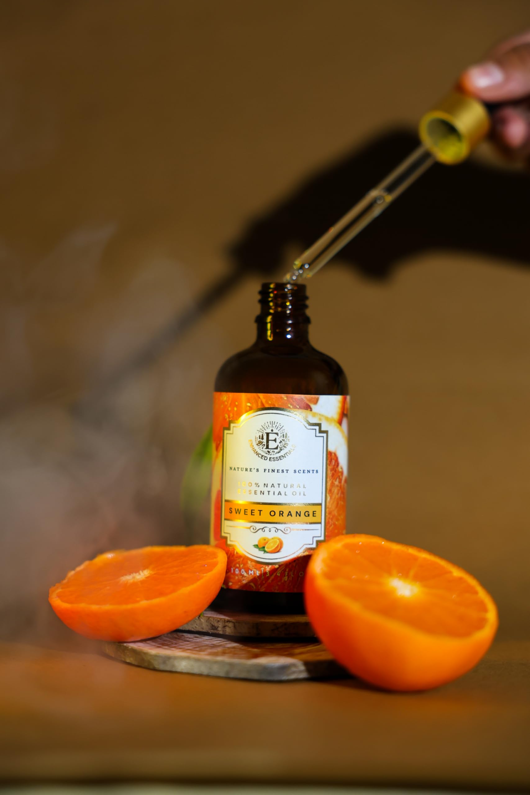 Premium amber glass bottle of Enhanced Essentials Sweet Orange Oil