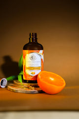 Dropper filled with Enhanced Essentials Sweet Orange Oil for precise skincare application